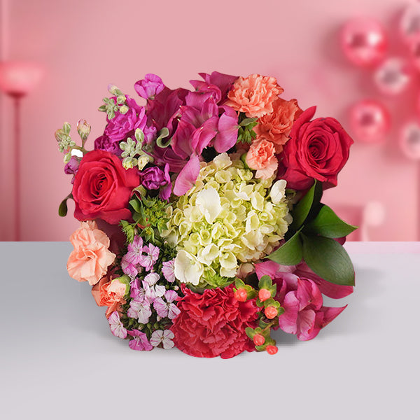 Blissful mixed flowers bouquet with colorful fresh seasonal blooms including pink, yellow, orange, and purple flowers