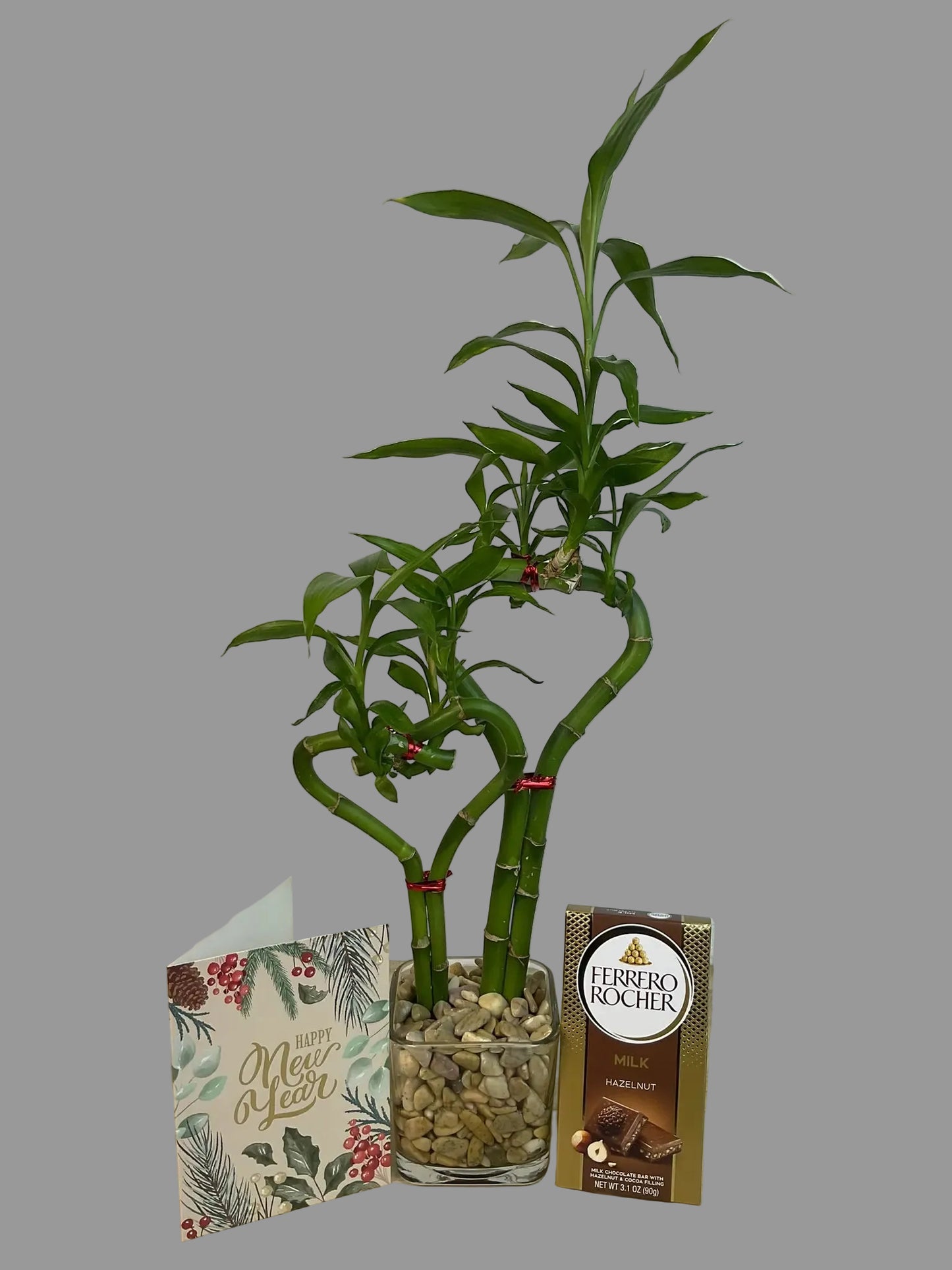 Double heart lucky bamboo with New Year card and Ferrero Rocher Bar in 3.5 inch square vase 