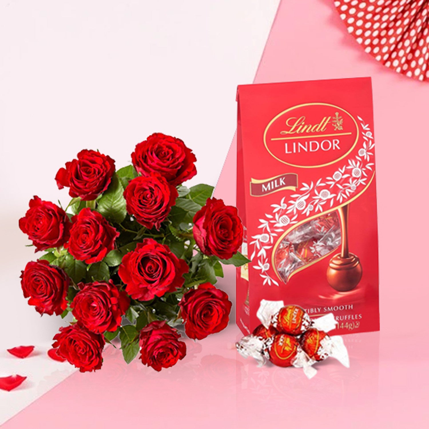 Dozen red roses bouquet with Lindt Lindor milk chocolate gift combo