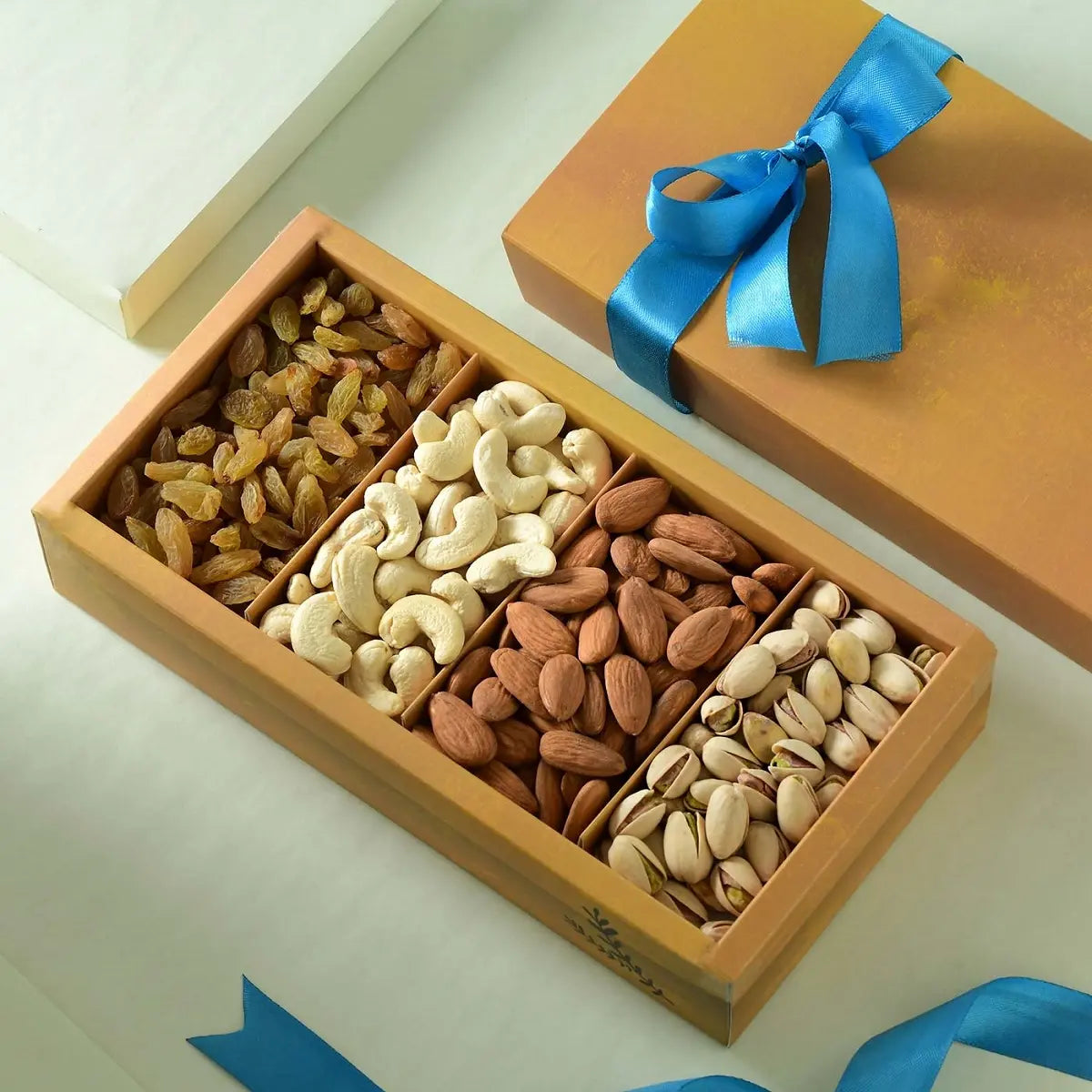 Mixed nut crate gift box with cashews almonds pistachios and golden raisins