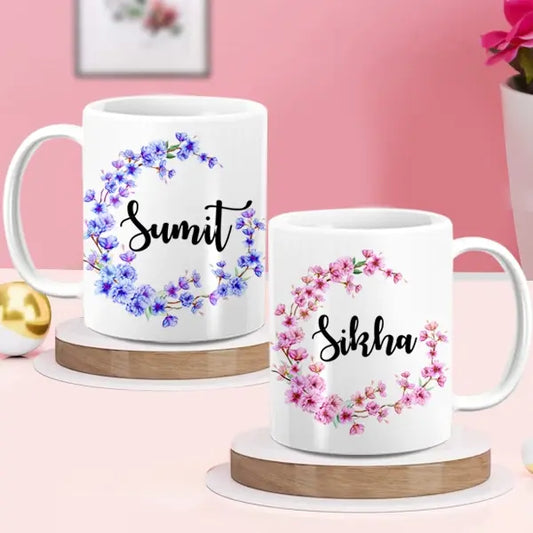 Two white text personalized ceramic mugs